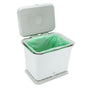 The Full Circle Fresh Air Compost Bin is a modern white rectangular bin with a hinged lid and green liner, designed for kitchen waste to keep your space odor-free.