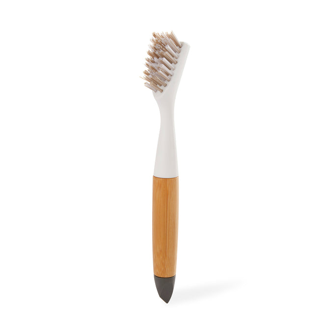 The Full Circle Micro Manager Detail Brush features an ergonomic design with a white bristle head, sleek white and bamboo handle, and black pointed tip—ideal for precise kitchen cleaning tasks.