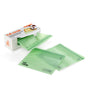 A Full Circle box dispenses translucent Compostable Zipper Sandwich Bags, with two bags pulled out and one partially inside. The eco-friendly, plant-based bags feature logos printed on them to highlight their compostable design.