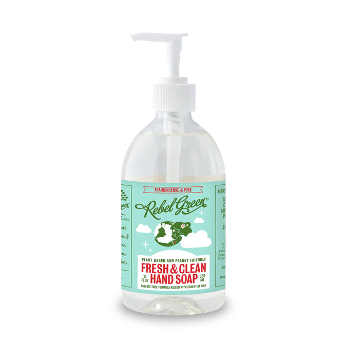 Rebel Green Fresh & Clean Hand Soap comes in a clear pump bottle with a green and white label featuring Earth and clouds. This plant-based soap, scented with frankincense and pine, gently nourishes skin and supports your natural moisture barrier.