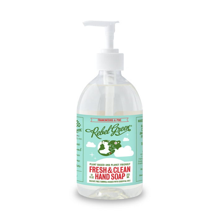 Rebel Green Fresh & Clean Hand Soap comes in a clear pump bottle with a green and white label featuring Earth and clouds. This plant-based soap, scented with frankincense and pine, gently nourishes skin and supports your natural moisture barrier.