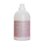 A white plastic bottle with a pink label displays Rebel Green Fresh Laundry Detergent Liquid - 3x Concentrated, highlighting that it's sulfate-free, vegan, organic, and contains no synthetic fragrances.