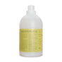 A large white Rebel Green bottle with a yellow label contains Fresh Laundry Detergent Liquid - 3x Concentrated. The screw cap bottle features product details, gentle ingredients, and usage instructions on the back label.