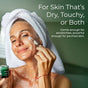 A woman with a towel on her head applies cream to her face, smiling. Text: Tree To Tub Deep Hydrating Face Moisturizer for Sensitive Skin with Green Tea—gentle for sensitivities, powerful for dry skin.