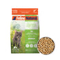 A bag of Feline Natural Grain-Free, Freeze-Dried Cat Food sits beside a bowl of its freeze-dried pellets. The Feline Natural packaging displays a cat and key product details.