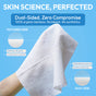 A hand holds a Clean Facial Towel by Fomin against a blue background. Text notes its 100% organic bamboo, dual-sided texture (one silky, one textured), gentle exfoliation, and protection—ideal for sensitive skin.