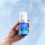 A hand holds a Fomin Deodorant Stick against a blue sky. Circular text highlights its eco-friendly design, suitability for sensitive skin, and effective odor-neutralizing formula.