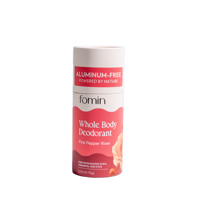 The Fomin Deodorant Stick in Pink Pepper Rose scent comes in pink and white eco-conscious packaging with a rose illustration and an “Aluminum-Free” label, designed to neutralize odors.