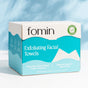 A box of Fomin Exfoliating Facial Towels in blue and white packaging, eco-friendly certified, labeled ultra-soft, hypoallergenic, and designed to help reduce acne for clearer skin.