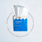 An open blue and beige Fomin Feminine Wipes packet displays white textured wipes, highlighting features like sensitive wipes for vaginal health—free from aluminum, phthalates, and sulfates.