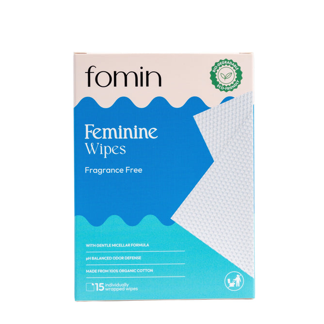 Fomin Feminine Wipes, fragrance-free, come in a box of 15 individually wrapped sensitive wipes. Blue and white packaging features organic cotton, micellar formula, and pH balanced odor defense to support vaginal health.