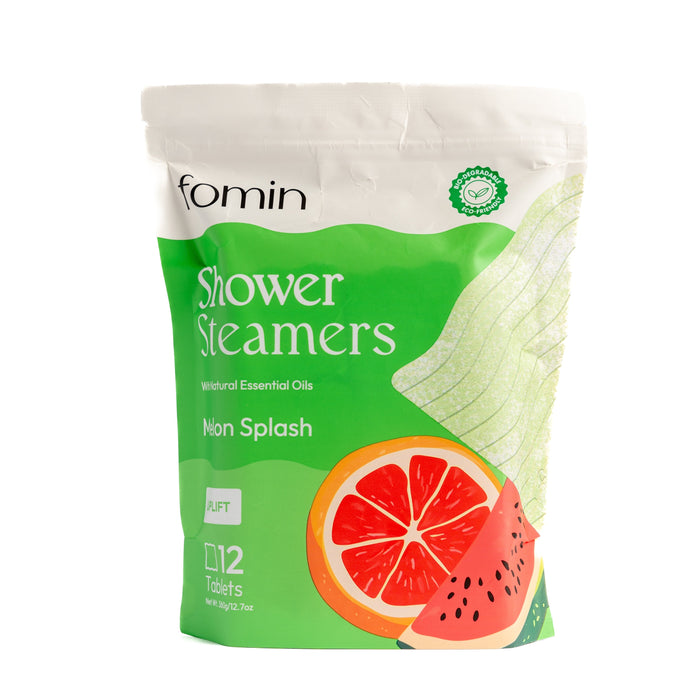 A standing pouch of Fomin Shower Steamer - Melon Splash features grapefruit and watermelon illustrations on a green and white pack. The 12 tablets provide aromatherapy benefits with natural essential oils.