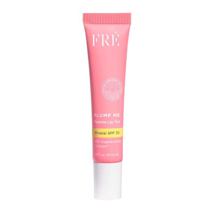 A pink tube of FRÉ Skincare PLUMP ME Peptide Lip Tint Mineral SPF 30 with white and yellow text, a white cap, and 0.51 fl oz (15 mL) inside.