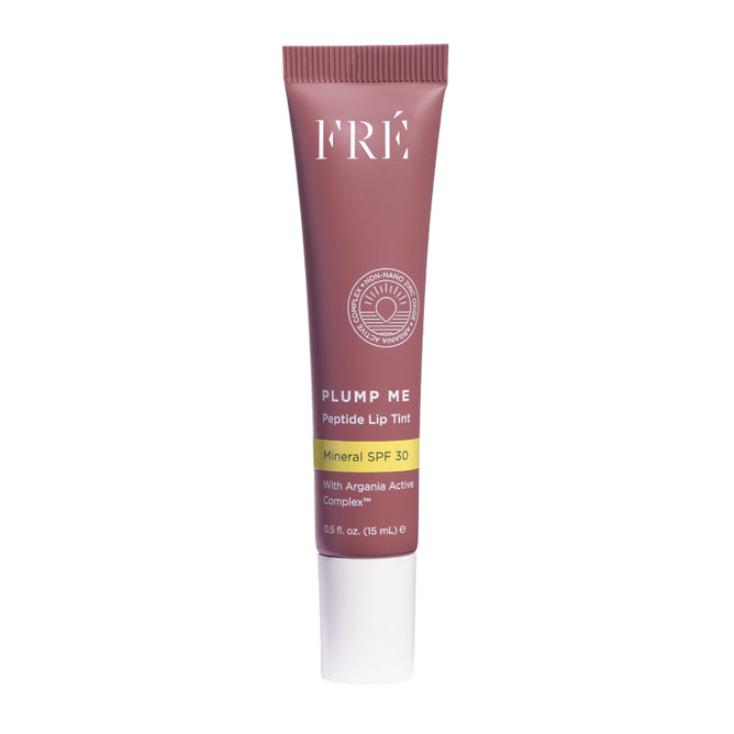 A mauve tube of FRÉ Skincare PLUMP ME Peptide Lip Tint Mineral SPF 30, 0.5 fl oz (15 mL), stands upright against a white background.