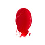 A vibrant red, oval smear of FRÉ Skincare’s PLUMP ME Peptide Lip Tint Mineral SPF 30 appears on a white backdrop, featuring uneven edges and small splatters at the bottom.