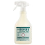 Mrs. Meyer's Fabric Freshener Spray in Honeysuckle scent offers a long-lasting, odor-fighting formula. The cream bottle has a white nozzle, with the label showing product and usage details.