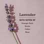 A sprig of lavender rests on a pale pink background. Text reads: Mrs. Meyer's Fabric Freshener Spray—lavender with notes of orange peels, herbs, cedar, and rose—offers long-lasting scent as the lavender casts a shadow to the left.