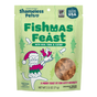 A green bag of Shameless Pets Crunchy Cat Treats - Fishmas Feast Crunchy features a festive cat illustration, text highlighting crunchy tuna treats with catnip, and a round window displaying the treats inside.