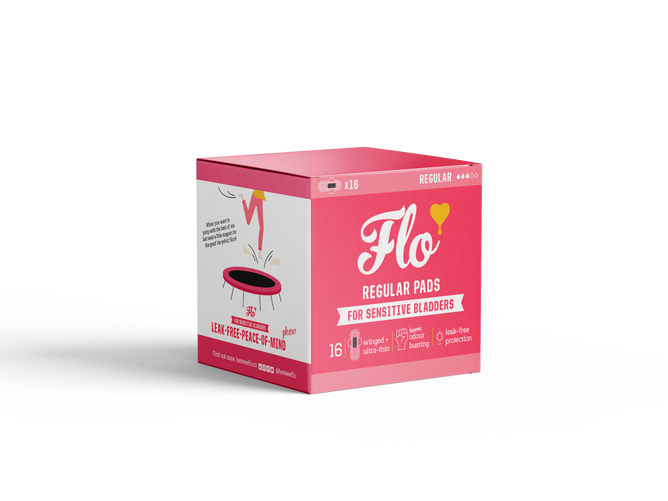 Here We Flos Flo Sensitive Bladder Bamboo Pads come in a pink, heart-decorated box with a cartoon pad. Each pack includes 16 organic, plant-based pads that are leak-free and free from plastic and perfumes—ideal for sensitive bladders.
