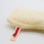 A natural Luffa Fiber Kitchen Sponge from Floofah, featuring a cream-colored tag with "Floofah" written in red text, displayed on a white surface.