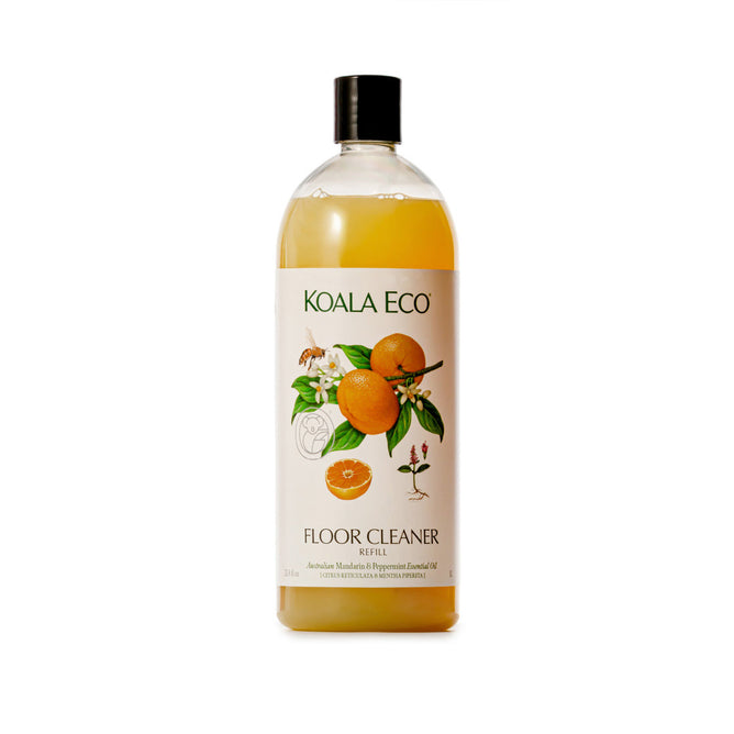A clear plastic Koala Eco Floor Cleaner Refill bottle with a black cap. Its label, with oranges, leaves, and flowers, highlights this natural cleaner made from mandarin and peppermint essential oils.