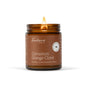 A lit brown glass jar candle labeled Fontana Candle Co. Jar Candle - Beeswax and Coconut Oil, a non-toxic candle made with essential oils, glows warmly against a white background.