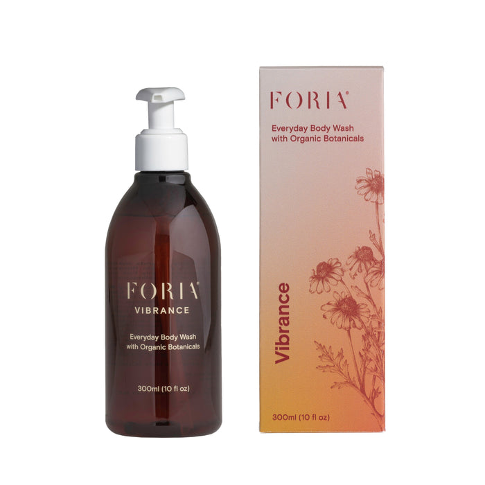 Foria Vibrance Everyday Body Wash with Organic Botanicals (300ml) sits beside its floral pink box, offering a fragrance-free, hydrating cleanse for daily use.