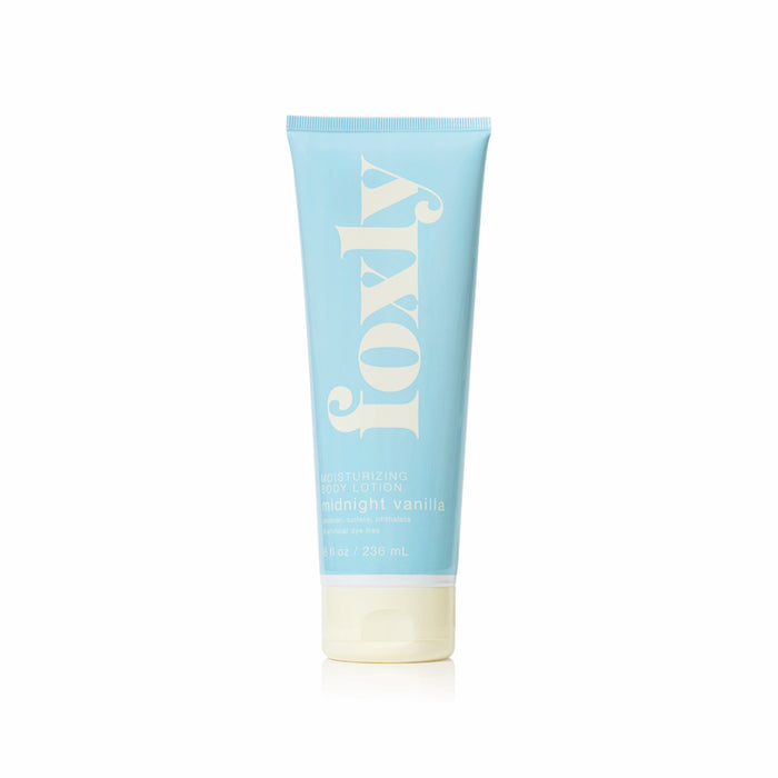 A light blue tube of Foxly Body Lotion with nourishing oils in midnight vanilla scent, standing upright against a white background for ultimate skin hydration.