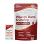 A pouch labeled Marie Originals Wounds, Burns & Chafing Ointment Packets with an individual packet in front. This salve supports skin regeneration for wounds, burns, cuts, sunburns, rashes, and chapped skin.