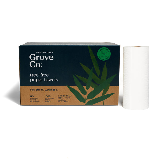 A box of Grove Co. 2-Ply Bamboo Paper Towels (140 sheets per roll) with green leaf graphics and recyclable packaging is shown beside a single upright white roll.