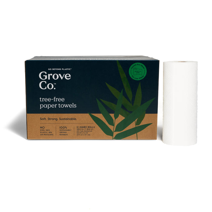 A box of Grove Co. 2-Ply Bamboo Paper Towels (140 sheets per roll) with green leaf graphics and recyclable packaging is shown beside a single upright white roll.