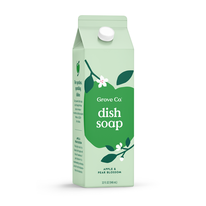 A light green carton of Grove Co. Dish Soap – Cuts Through Stuck-On Mess, with a white cap. The label shows a green apple shape, white flowers, and text: dish soap; apple & pear blossom; 32 fl oz (946 ml).