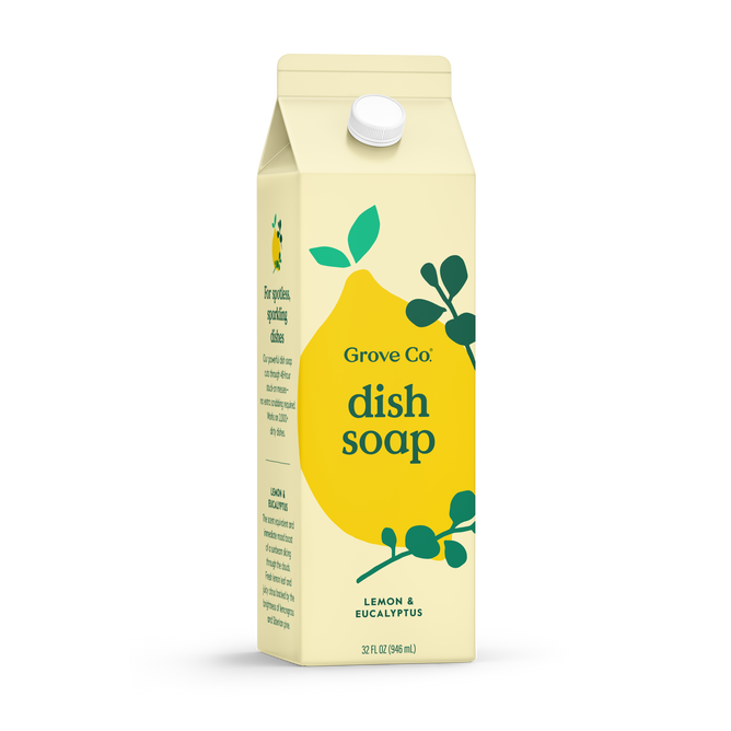 A cream-colored, carton-shaped 32 fl oz Grove Co. Dish Soap features a large lemon with green leaves and a label reading Lemon & Eucalyptus. This natural soap cuts through stuck-on messes.