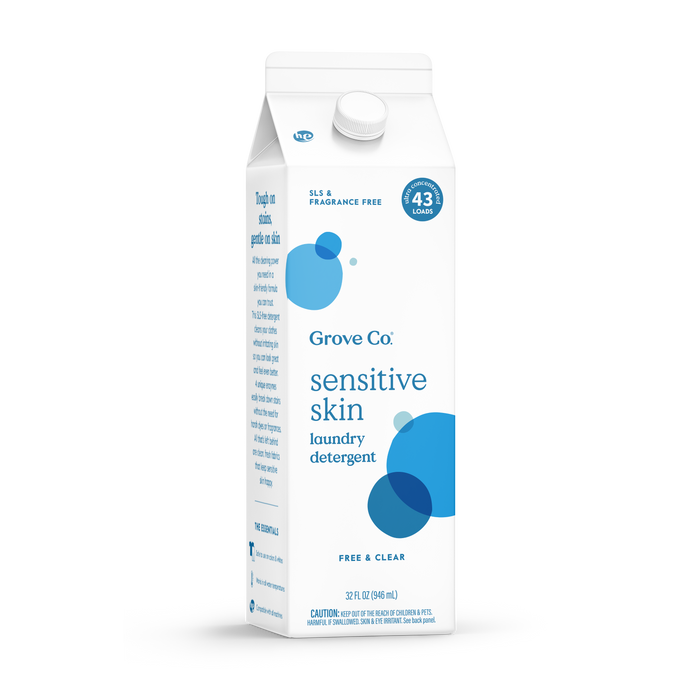 A white carton of Grove Co. Sensitive Skin Laundry Detergent – No SLS or Synthetic Dye, labeled Free & Clear for 43 loads, features blue bubbles and highlights its eczema-safe, SLS- and fragrance-free formula.
