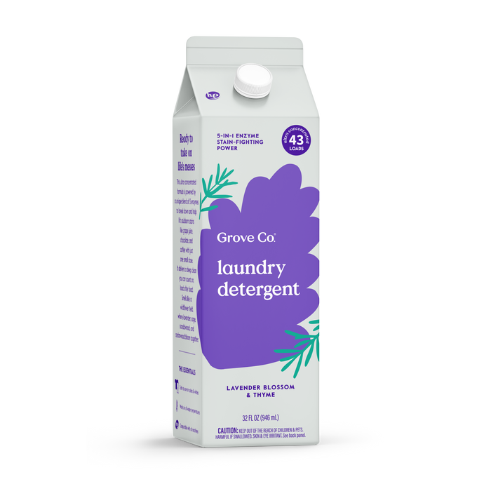 A 32 oz (946 mL) carton of Grove Co. Laundry Detergent – 5-in-1 Enzyme Stain Fighting Power in lavender blossom and thyme scent, with an updated purple and white design, green leaf accents, and effective for 43 loads.