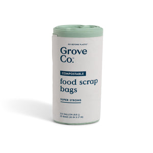 A roll of Grove Co. Compostable Food Scrap Bags with a white and light green label, featuring 25 super strong 2.6-gallon bags—ideal for kitchen composting.