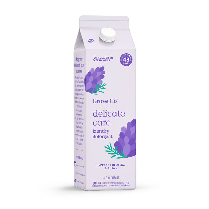 A lavender carton of Grove Co. Delicate Care Laundry Detergent – Prevents Fading & Pilling, scented with lavender blossom and thyme, features purple floral art and notes it covers 43 loads while helping extend garment wear.