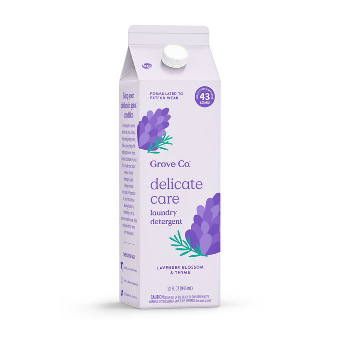 A lavender carton of Grove Co. Delicate Care Laundry Detergent – Prevents Fading & Pilling, scented with lavender blossom and thyme, features purple floral art and notes it covers 43 loads while helping extend garment wear.