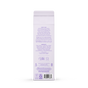 Back of a white Grove Co. Delicate Care Laundry Detergent bottle with purple text showing usage instructions, ingredients, recycling symbols, and manufacturer info. The rectangular bottle resembles an enzyme laundry detergent container.