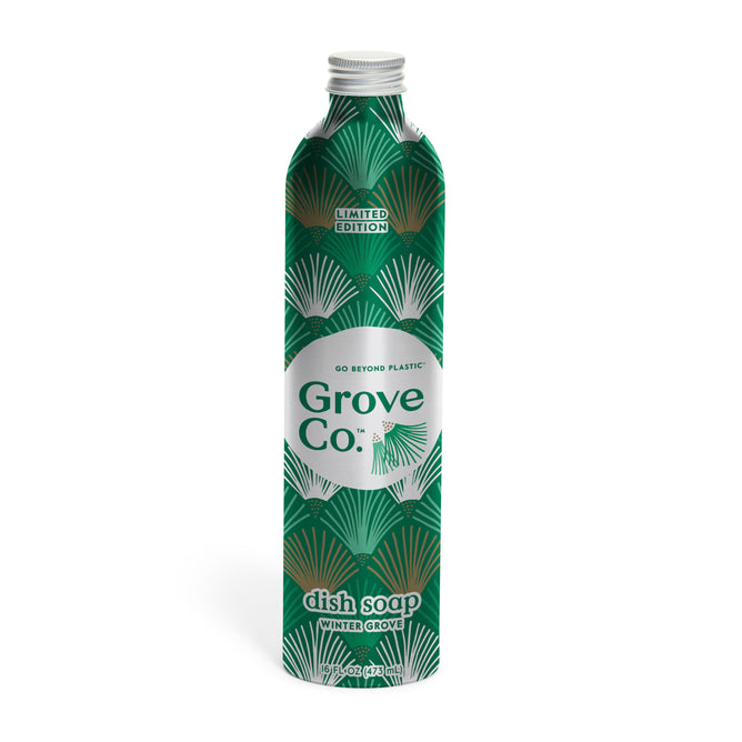 A limited edition Grove Co. Dish Soap Refill from the Winter Collection, featuring a green bottle with a decorative leaf pattern and white cap, labeled 