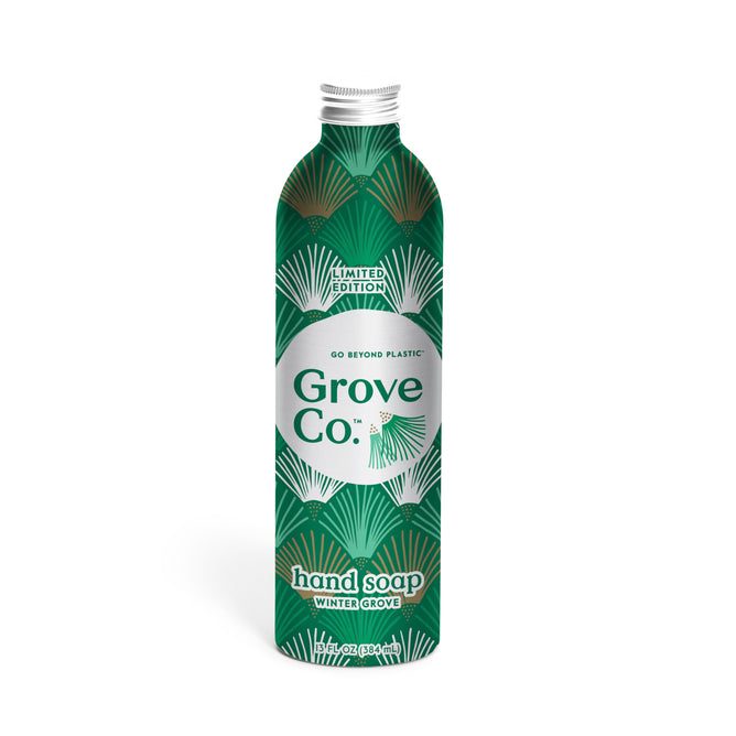 A green and silver aluminum bottle labeled Grove Co. Hand Soap Refill - Winter Collection features a leafy design, emphasizing this sustainable, plastic-free, plant-based soap with natural origin fragrance.