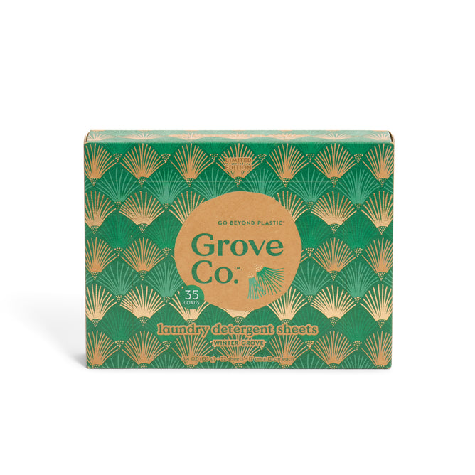 Grove Co. Laundry Detergent Sheets - Winter Collection come in a green and gold art deco box with 35 pre-measured sheets, the “White Grove” scent, and bio-based ingredients—an eco-friendly addition to your winter laundry routine.