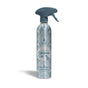 A limited edition Grove Co. Multi-Purpose Cleaner – Winter Collection in a silver and blue spray bottle with a patterned design, trigger nozzle, water droplet graphics, and made with bio-based ingredients.