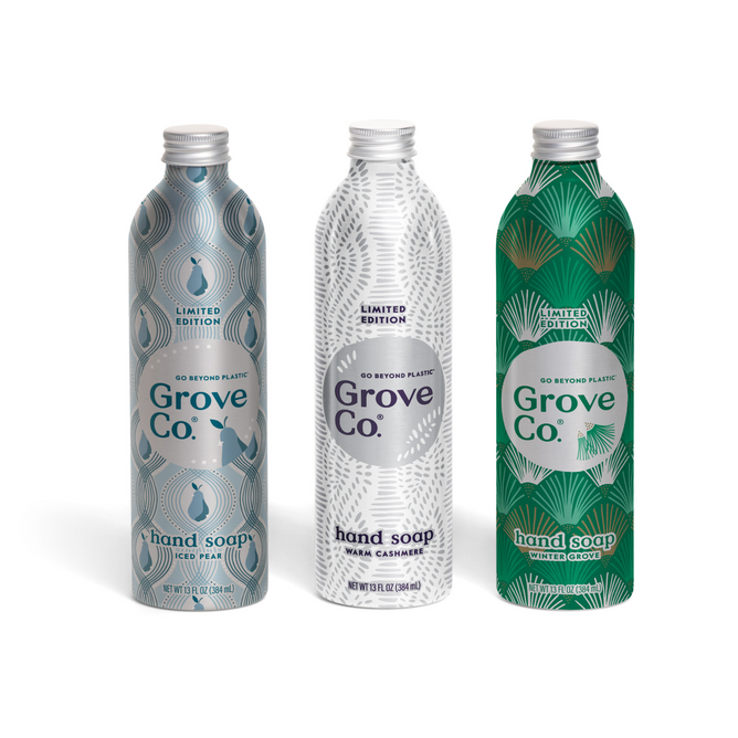 The Grove Co. Hand Soap Set - Winter Collection features three limited edition metal bottles, each with unique label designs in Iced Pear, Warm Cashmere, and Winter Grove scents.