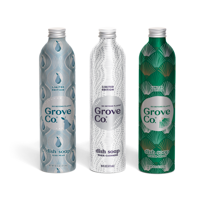 Grove Co. Dish Soap Set - Winter Collection includes three metallic bottles with exclusive designs: light blue peacock, silver leaf, and dark green geometric foliage, each featuring the Grove Co. logo.