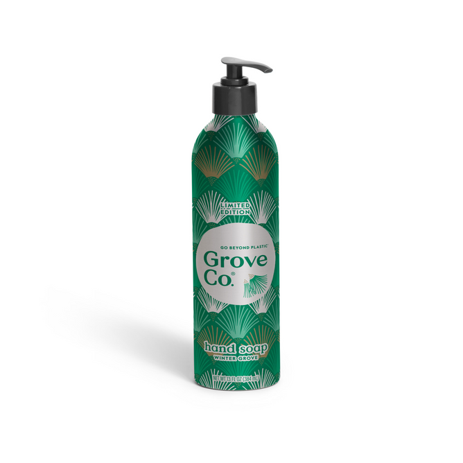A green Grove Co. Hand Soap Refill + Pump from the Winter Collection, featuring a white and green leaf design, labeled “Go Beyond Plastic” and “Winter Grove” on the front.
