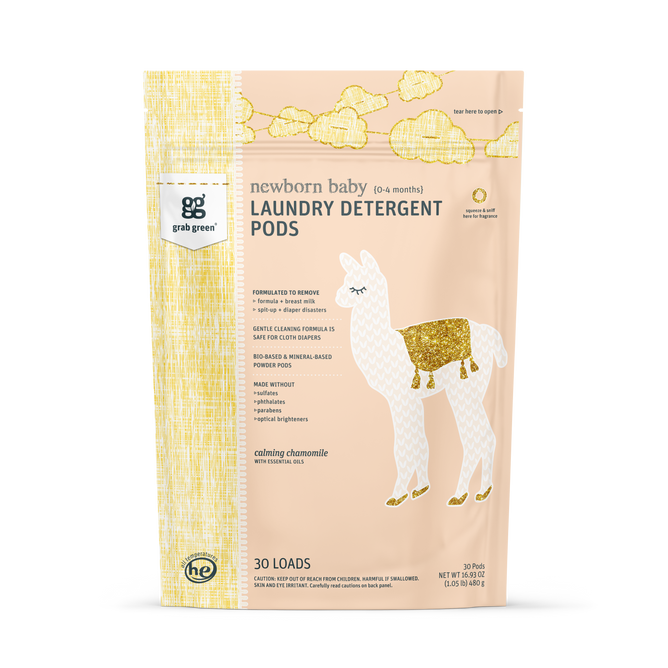 A pastel yellow and peach grab green bag of Newborn Laundry Detergent Pods - Chamomile features a white llama with gold accents, provides 30 loads, and is ideal for cloth diapers.