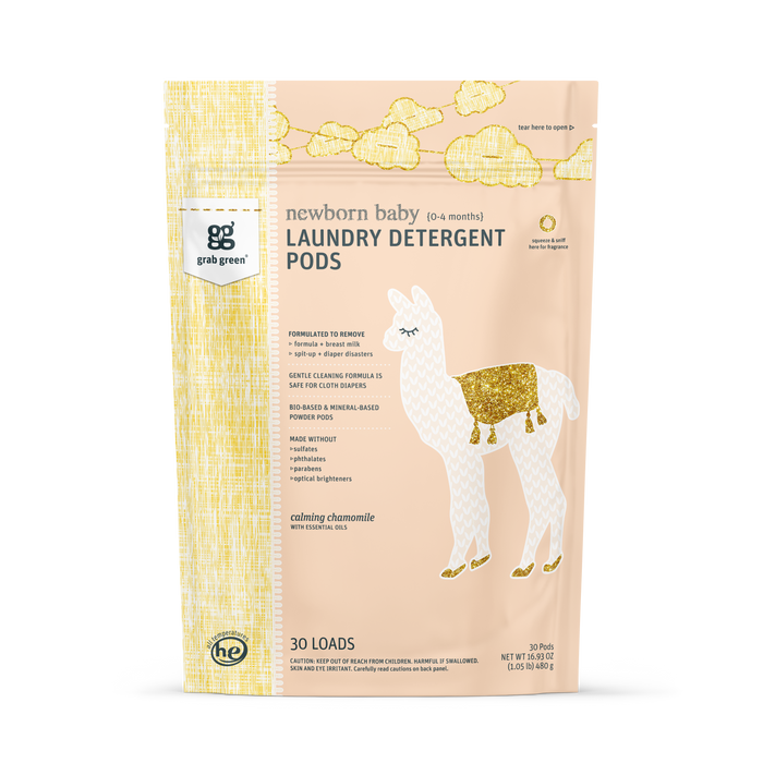 A pastel yellow and peach grab green bag of Newborn Laundry Detergent Pods - Chamomile features a white llama with gold accents, provides 30 loads, and is ideal for cloth diapers.