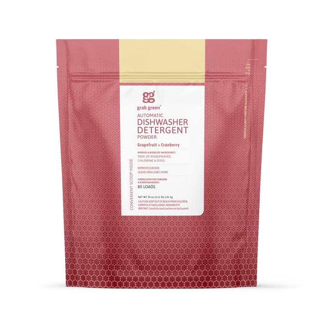 A stand-up pouch of grab green Automatic Dishwashing Detergent Powder - Grapefruit with Cranberry (Coming Soon!) delivers spot-free dishes and tough grease removal with eco-friendly ingredients and features a pink-red gradient design.