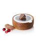 The AdHoc Cut'N Serve Fine Round Grater, featuring a photo-etched blade, holds a chunk of chocolate on top with chocolate shavings and three cranberries arranged nearby on a white background.